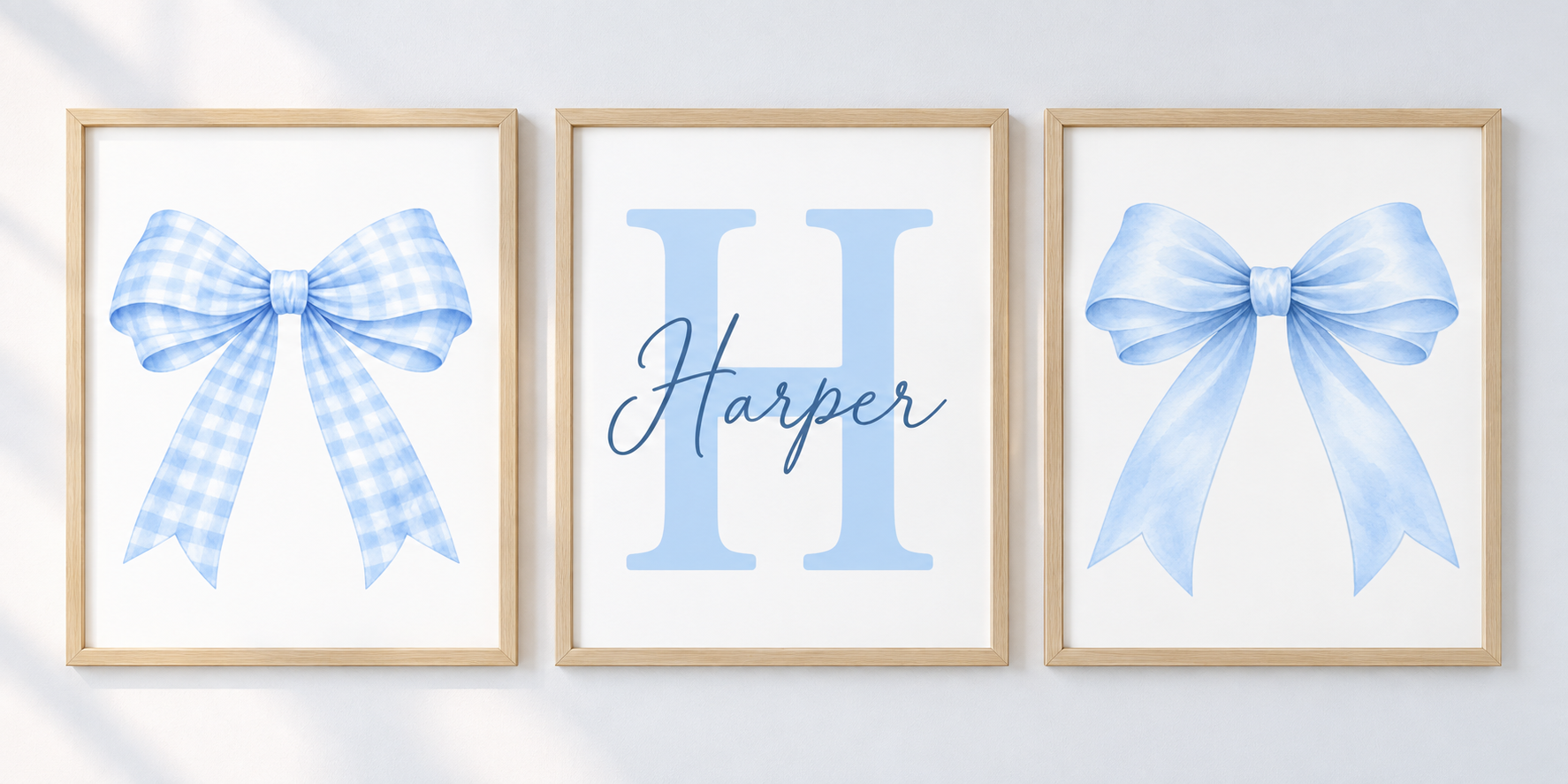 Blue bow and personalised name and initial print set; frames shown for styling only.