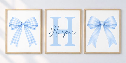 Blue bow and personalised name and initial print set; frames shown for styling only.
